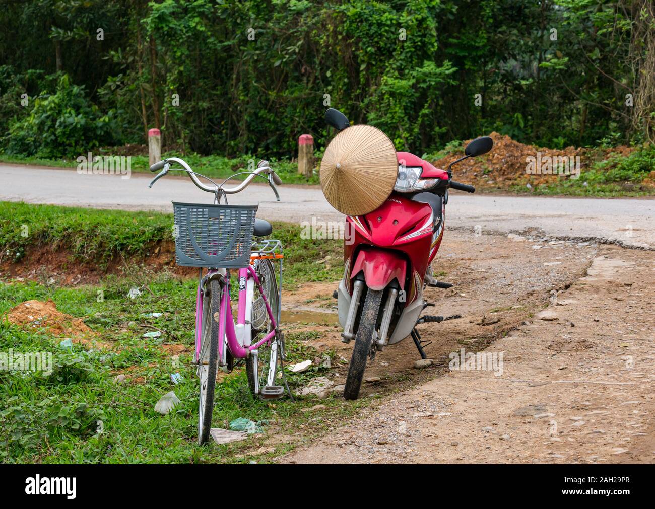 Bicycle and scooter parked by roadside with conical hat, Thai Nguyen Province, Northern Vietnam, Asia Stock Photo