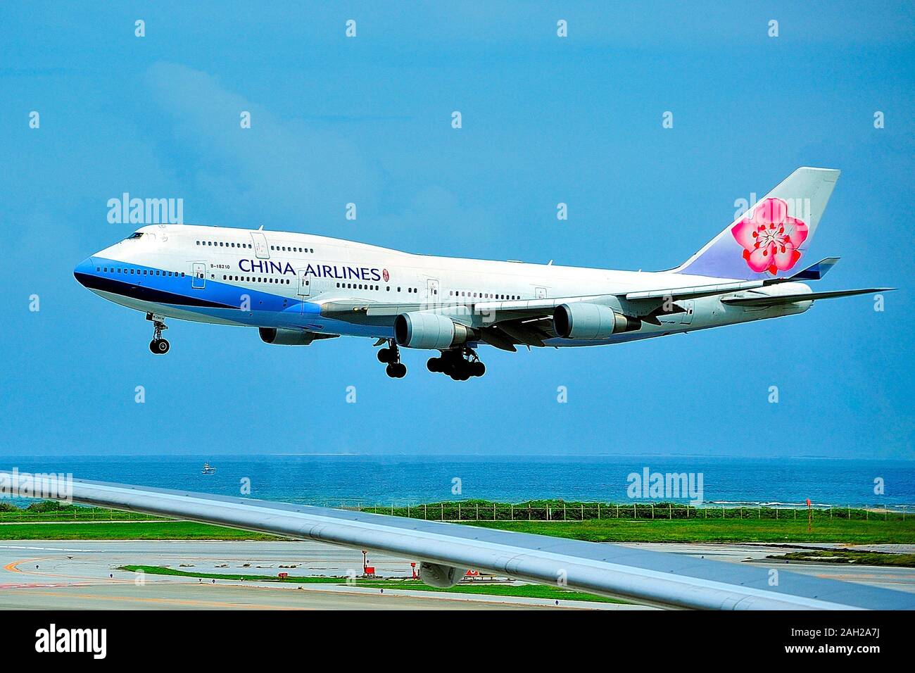 China Airlines Boeing B-747-400, B-18210, Landing at Naha Airport, Okinawa, Japan Stock Photo