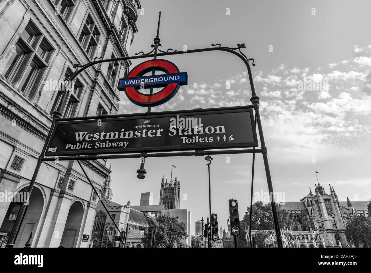 The Sign of the underground station of Westminster with the House of  Parliament and the Westminster Abbey in the background, London, England, GB  Stock Photo - Alamy