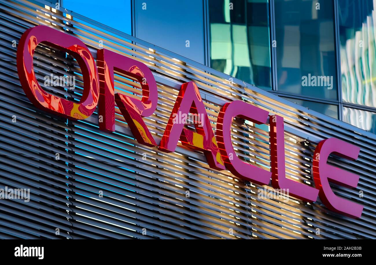 Bucharest, Romania - December 09, 2019: Oracle logo is seen on top of an architectural metal fence at ground floor of SkyTower office building in Buch Stock Photo