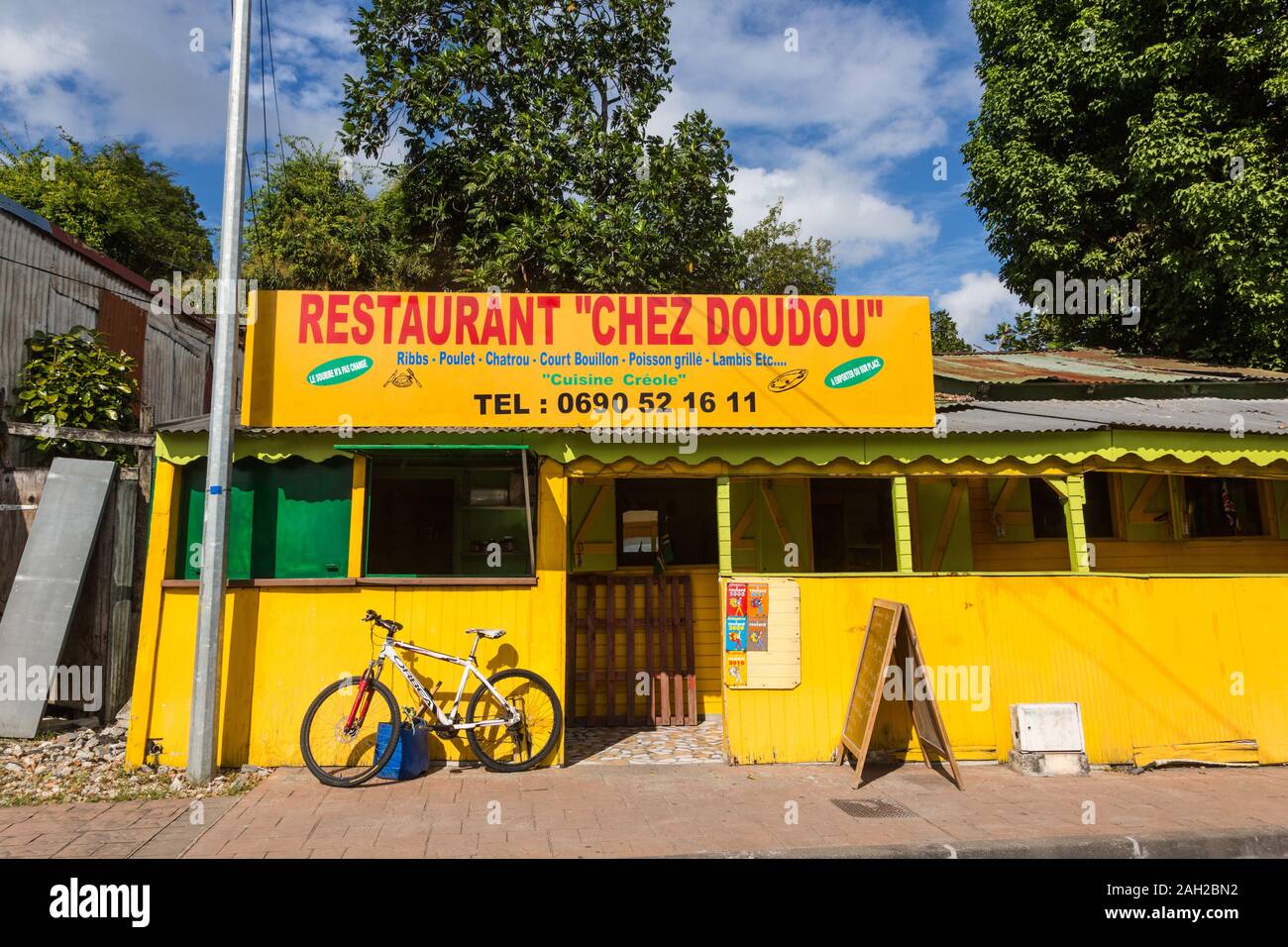 A small restaurant on the street in Pointe-a-Pitre in the Caribbean island nation of Guadeloupe. Stock Photo