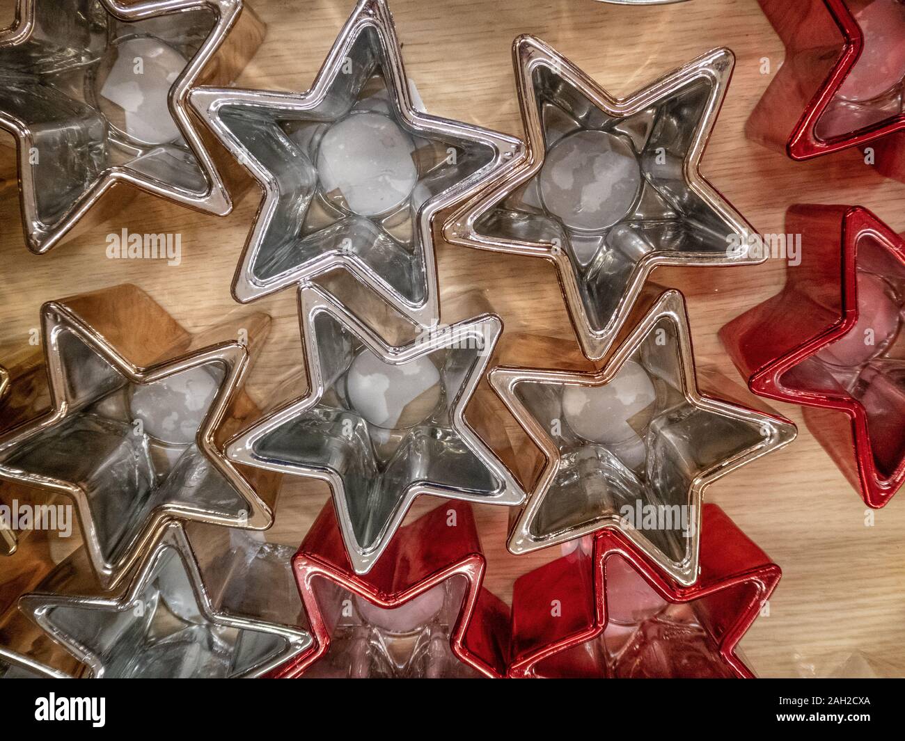 Set of star shaped Christmas candle holders, decorations in red and