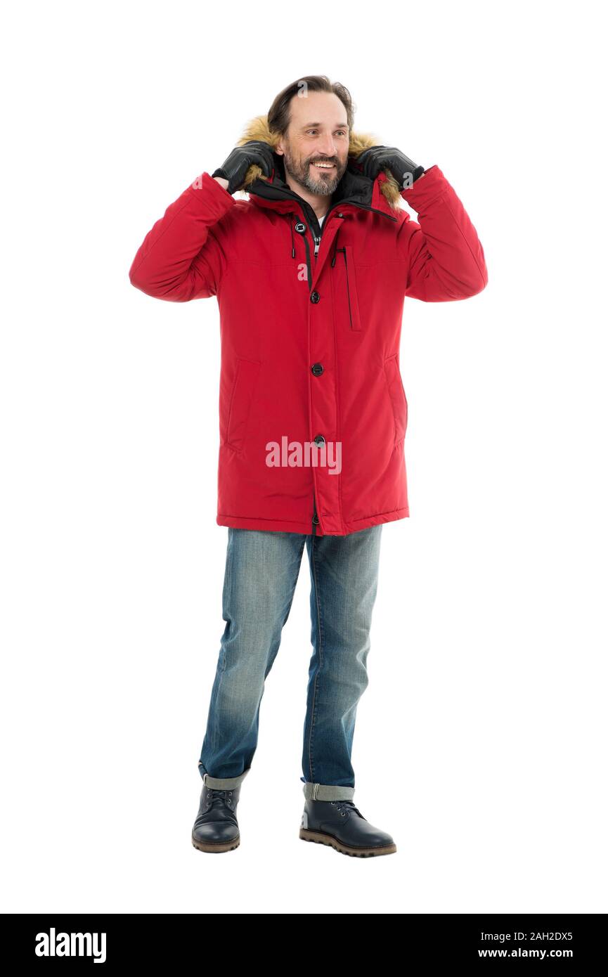 mature man is going to go outside. male winter fashion. seasonal trends for  fashionable men. man in red parka isolated on white. wintertime concept.  ready for any weather. cold winter climate Stock