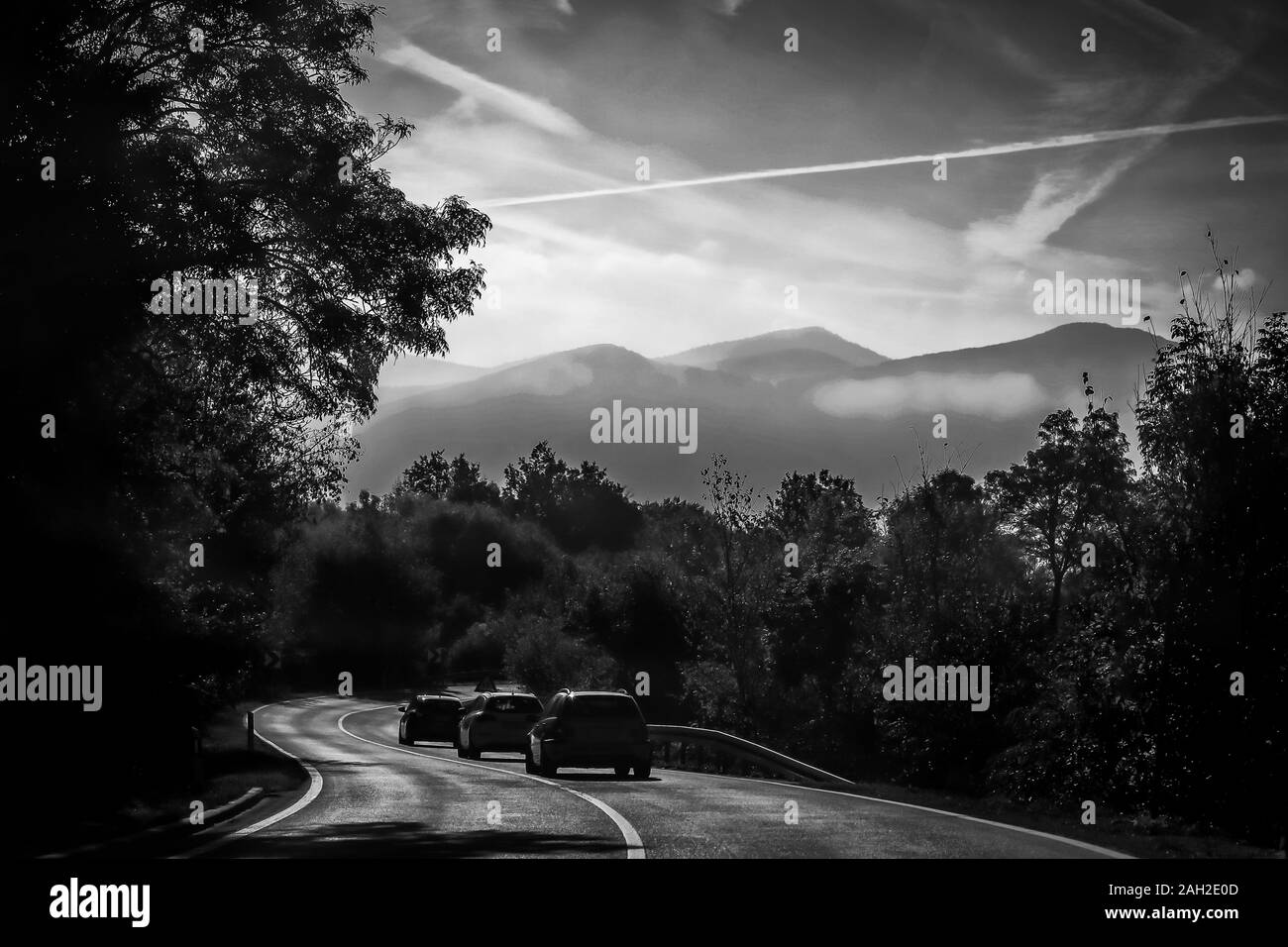 Three cars on road Black and White Stock Photos & Images - Alamy