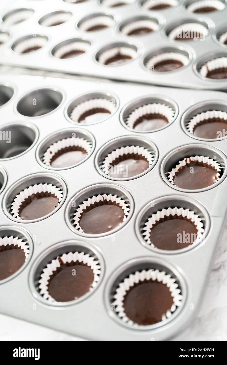 Baking chocolate mini cupcakes in cupcake pan Stock Photo Alamy