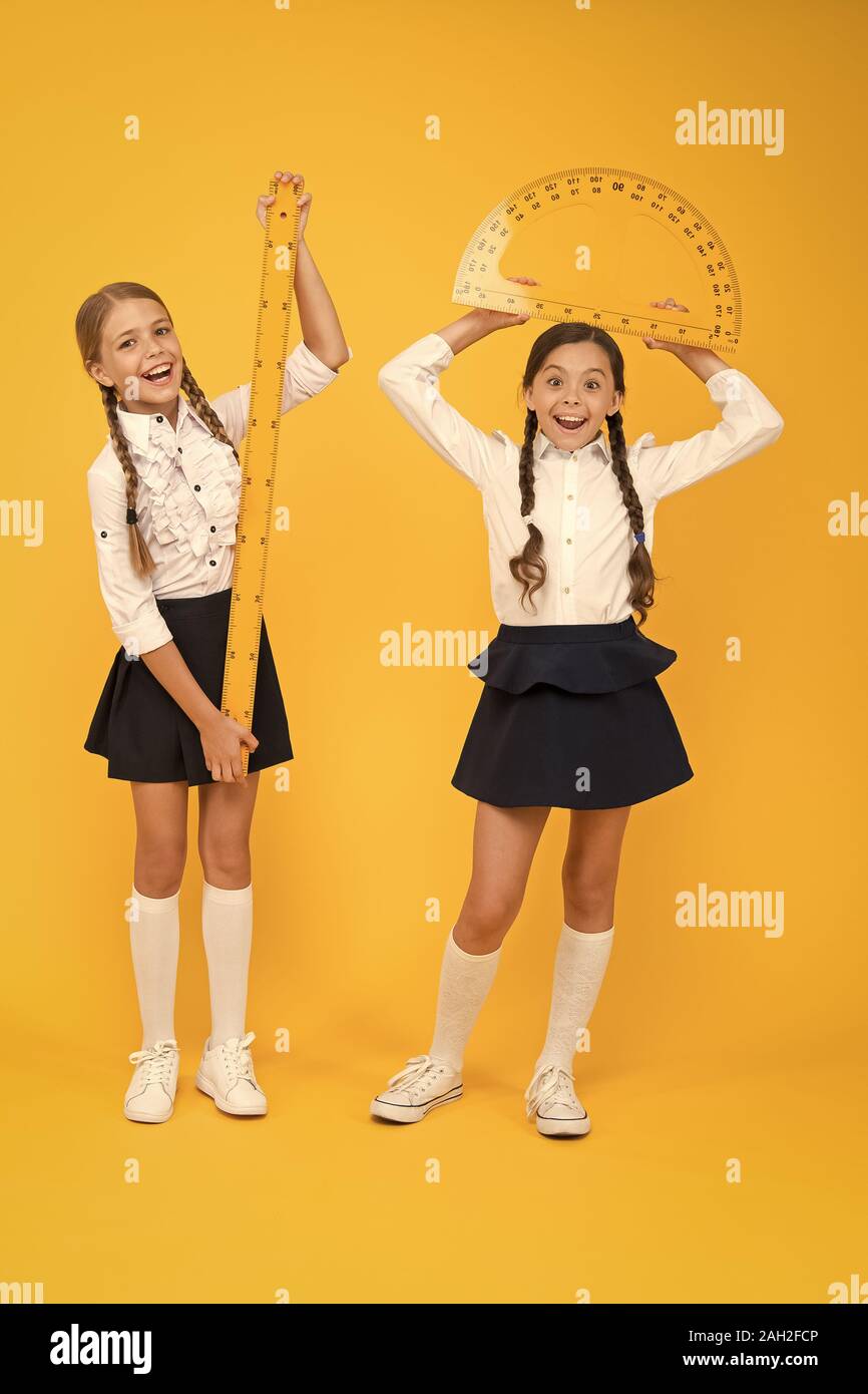 Formula. back to school. Maths and geometry. Kids in uniform at yellow ...