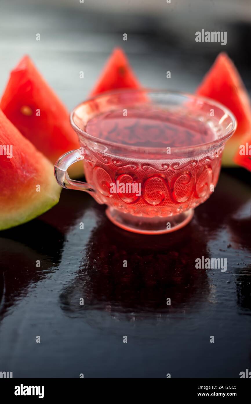 Vertical Shot Of Fruit Ice Tea Of Watermelon Seeds In A Transparent Glass Cup On Wooden Surface Along With Triangular Pieces Of Watermelon Stock Photo Alamy Vertical Shot Of Fruit Ice Tea Of Watermelon Seeds In A Transparent Glass Cup On Wooden Surface Along With Triangular Pieces Of Watermelon Stock Photo Alamy