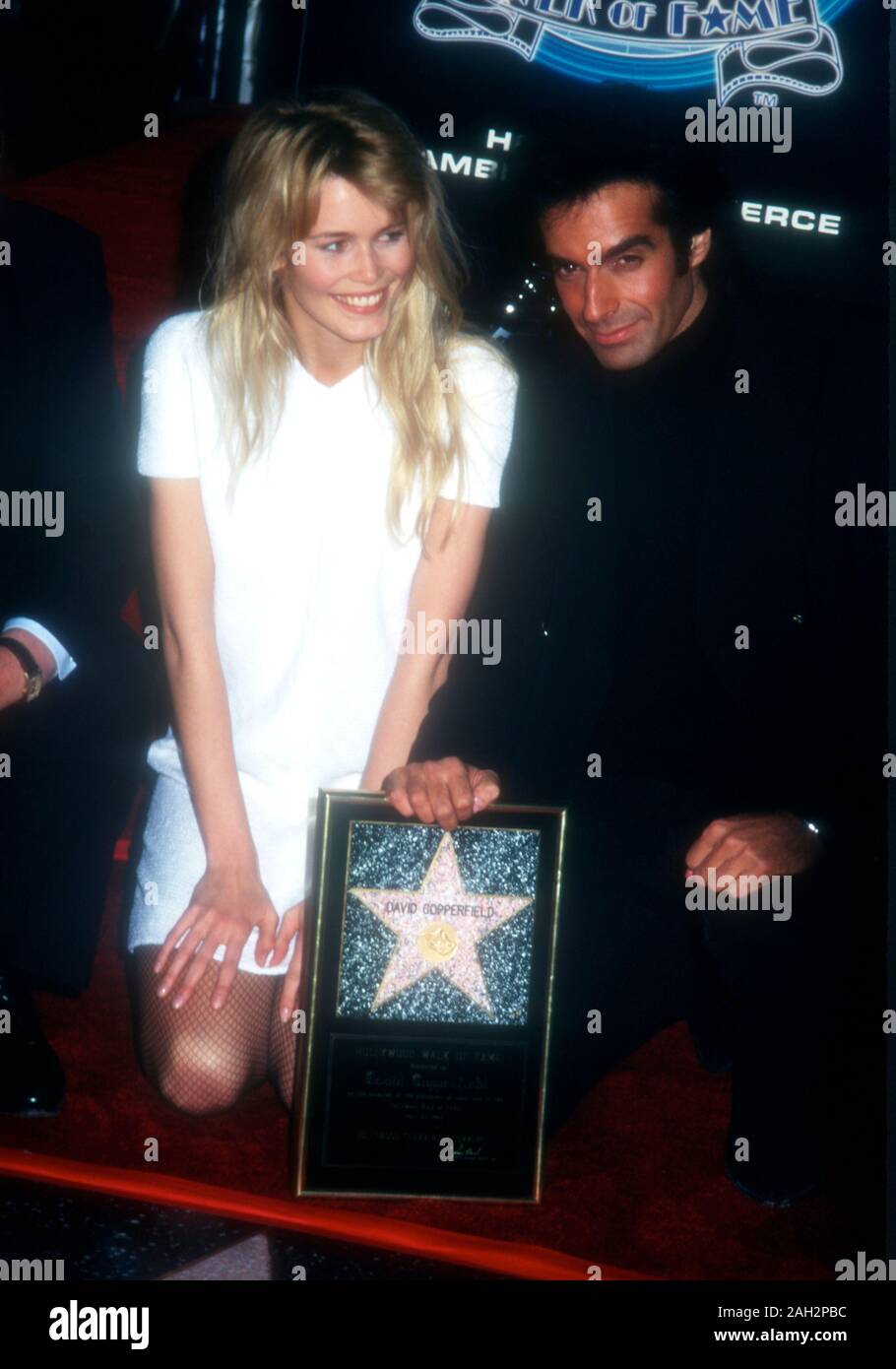 Hollywood, California, USA 25th April 1995 American Illusionist David Copperfield and model Claudia Schiffer attend David Copperfield's Hollywood Walk of Fame Star Ceremony on April 25, 1995 at 7001 Hollywood Blvd. in Hollywood, California, USA. Photo by Barry King/Alamy Stock Photo Stock Photo