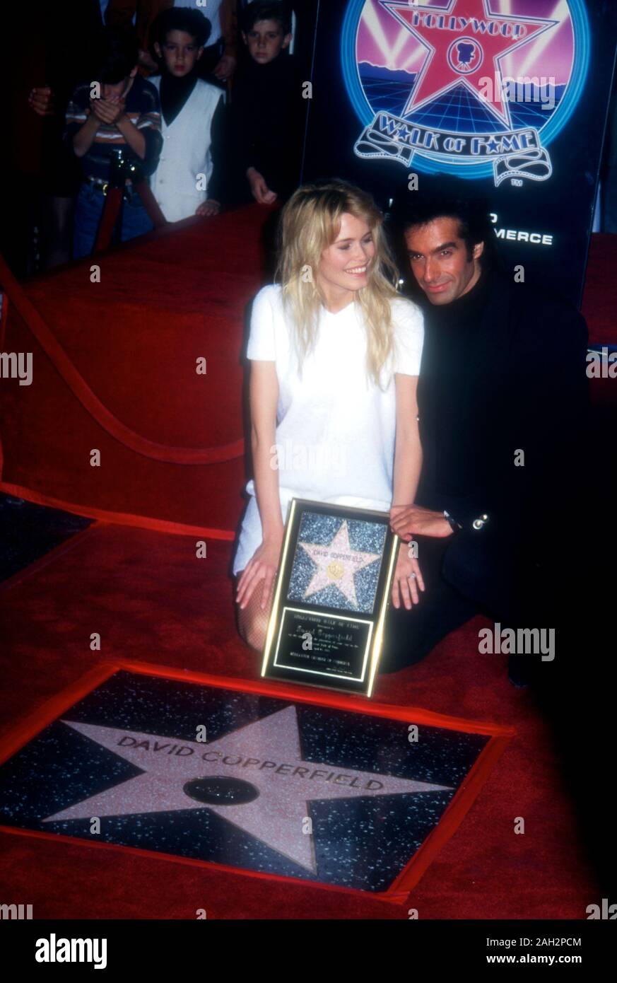 Hollywood, California, USA 25th April 1995 American Illusionist David Copperfield and model Claudia Schiffer attend David Copperfield's Hollywood Walk of Fame Star Ceremony on April 25, 1995 at 7001 Hollywood Blvd. in Hollywood, California, USA. Photo by Barry King/Alamy Stock Photo Stock Photo