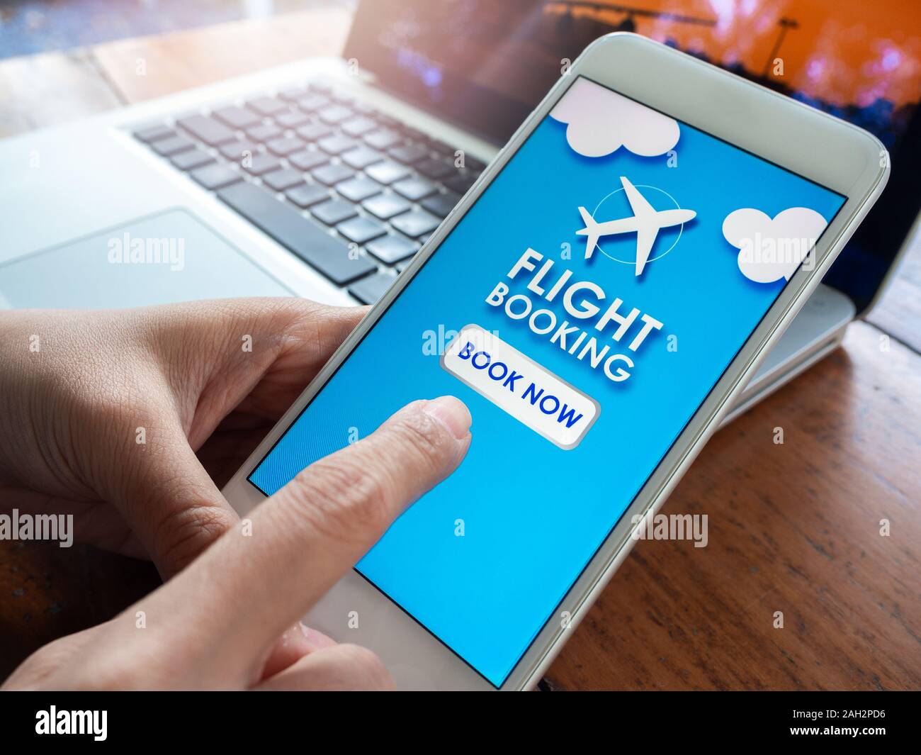 Flight booking online with smartphone. Finger touching on mobile phone