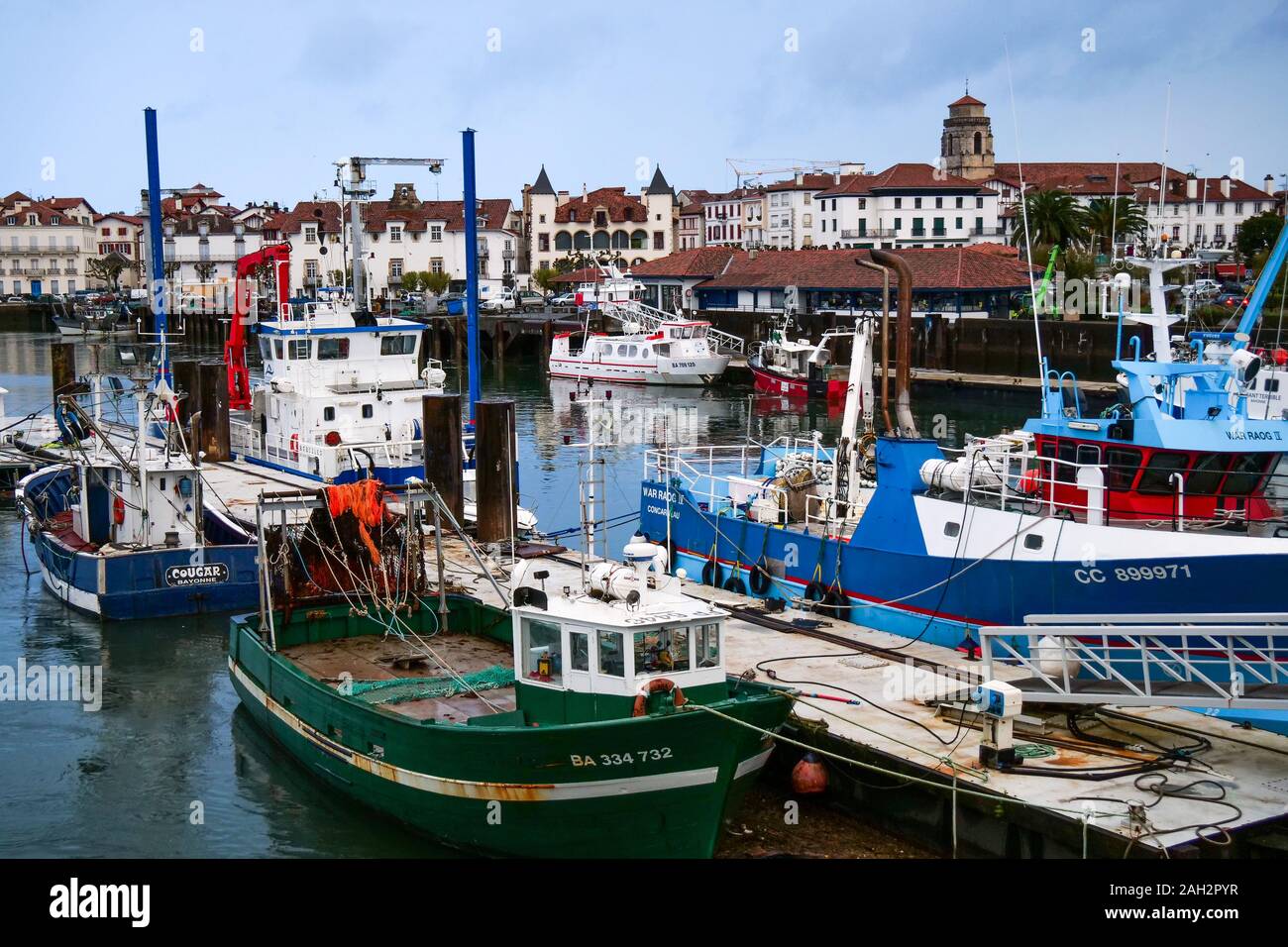 Fishing ships laying at quay on a winter morning, Saint-Jean de Luz, Basque country, Pyrénées-Atlantiques, France Stock Photo