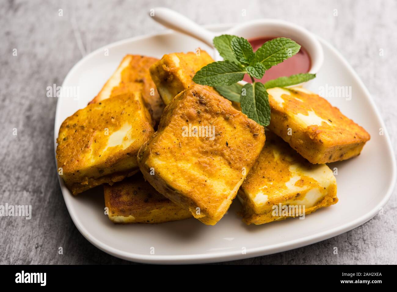 Amritsari Paneer Tikka made using cottage cheese cubes dipped in a