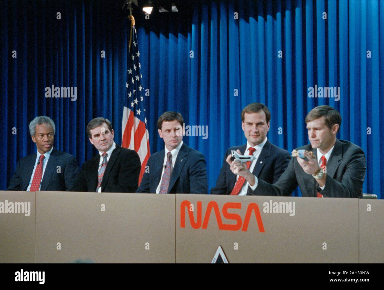 (23 Jan 1991) --- The five mission specialists assigned to the STS-39 Shuttle mission are pictured during a pre-flight press briefing.  Pictured left to right are Astronauts Guion (Guy) S. Bluford, C.  Lacy Veach, Gregory J. Harbaugh, Richard J. Hieb and Donald R. McMonagle.  McMonagle uses models to demonstrate deployment of the infrared background signature survey (IBSS) satellite. Astronauts Michael L. Coats, mission commander, and L. Blaine Hammond Jr.,  pilot, are out of frame at right. Stock Photo