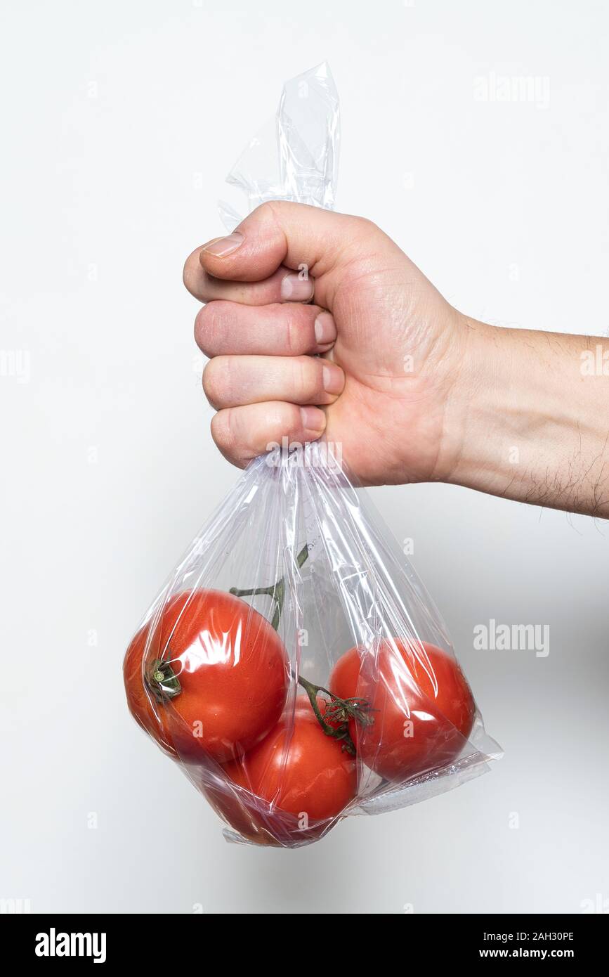 Some tomatoes in a plastic bag Stock Photo Alamy