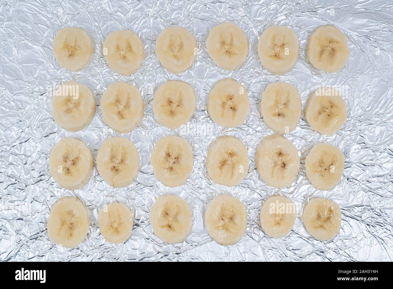 Some banana slices on aluminum foil Stock Photo