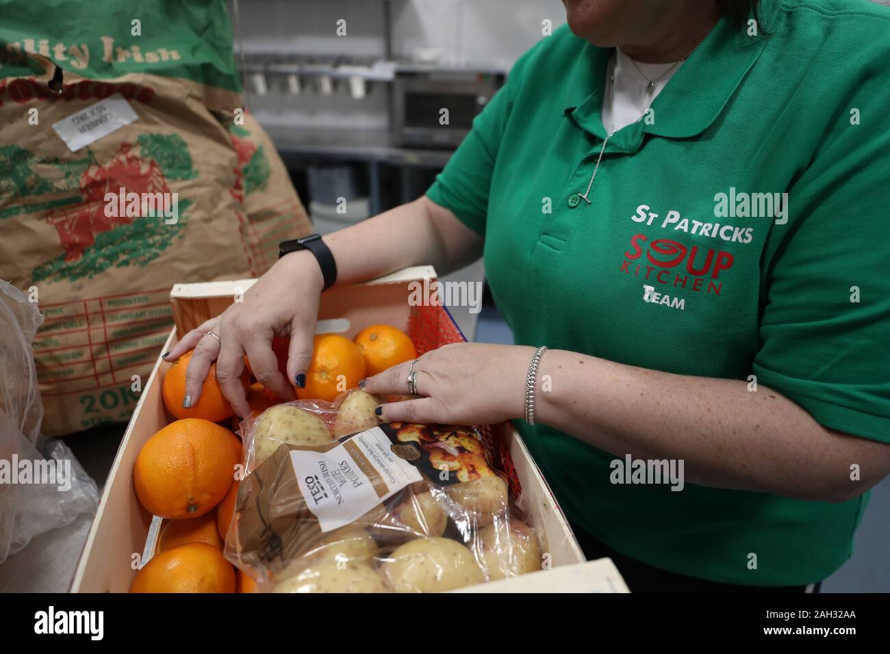 Volunteer Mandy Bickerstaffe sorts through food at St Patrick's Soup
