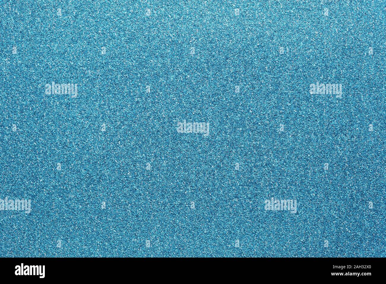 blue colored glitter paper texture abstract or natural shiny canvas