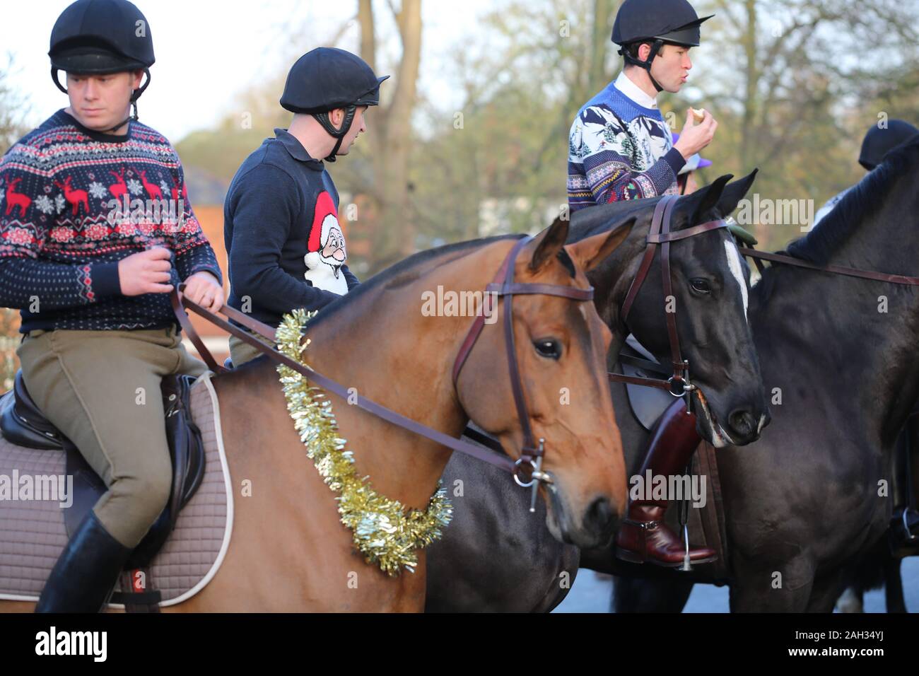 Blackheath, London, UK. 24th December, 2019. The King's Troop Royal Horse Artillery has donned Christmas outfits for the traditional Christmas eve ride from its base in Woolwich to Morden College in Blackheath. Credit: Rob Powell/Alamy Live News Stock Photo