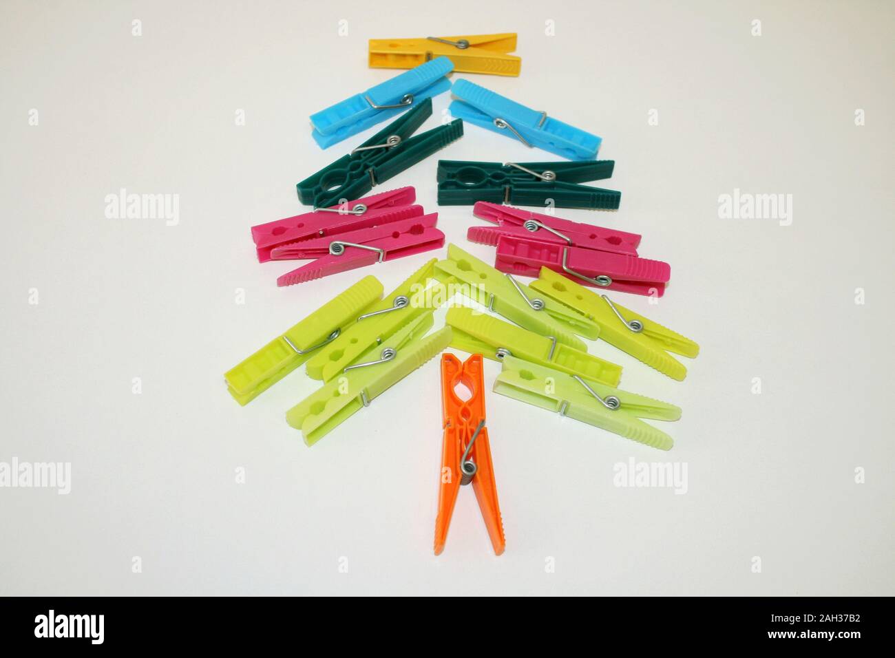 Clothespins on a white background as a Christmas tree Stock