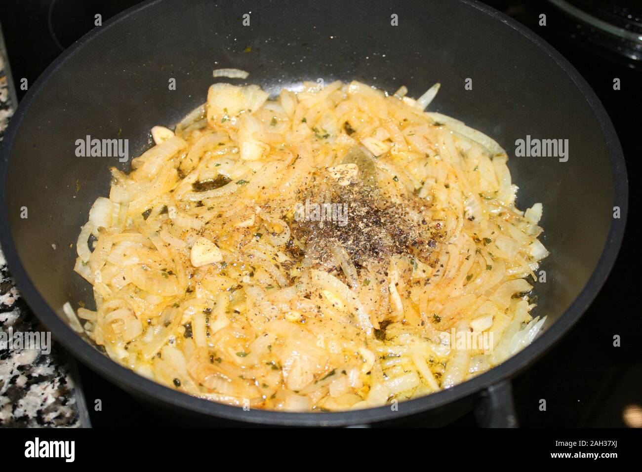The process of frying onions in a frying pan Stock Photo Alamy