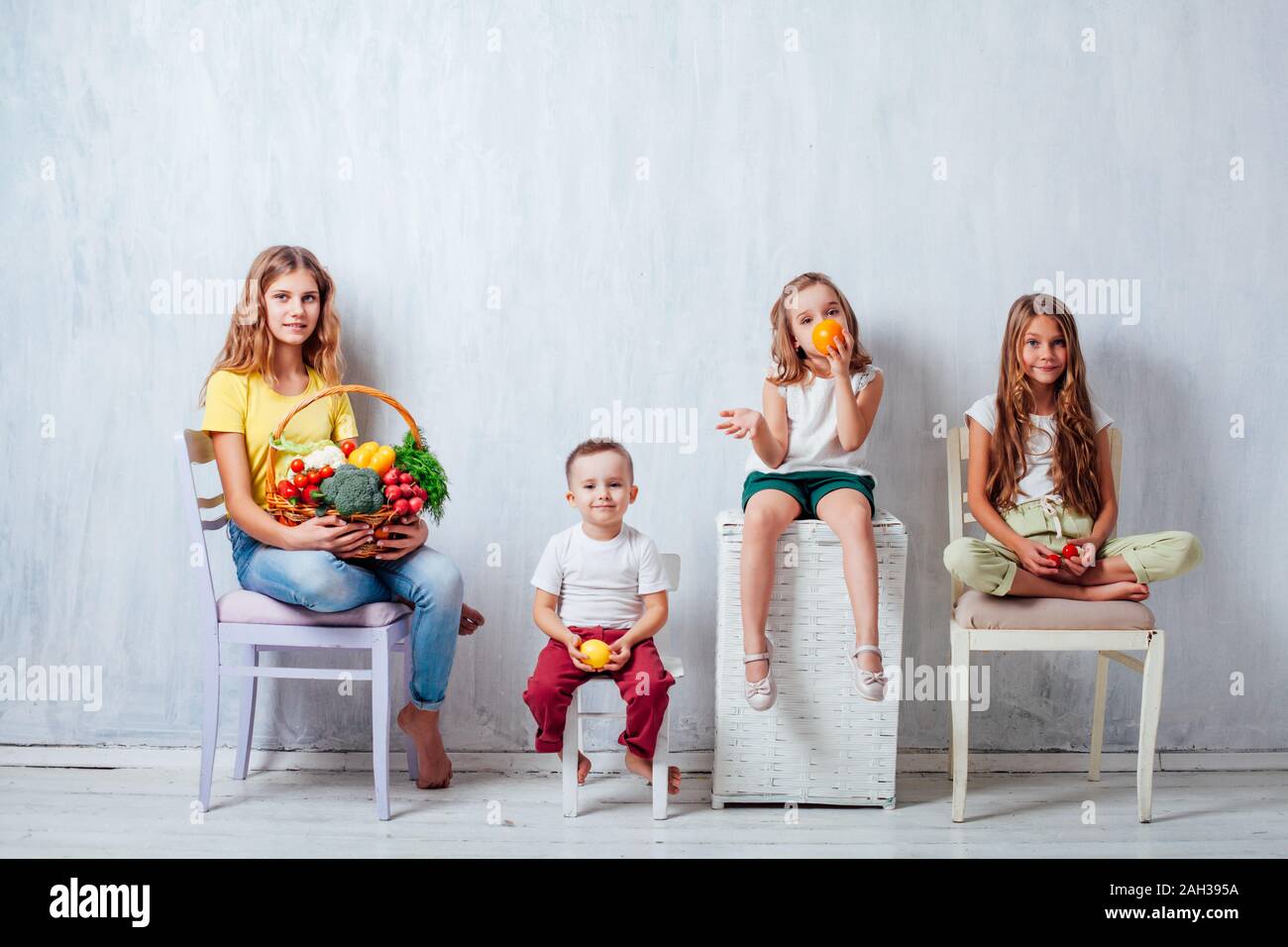 children sit with fresh vegetables healthy eating fruit Stock Photo Alamy