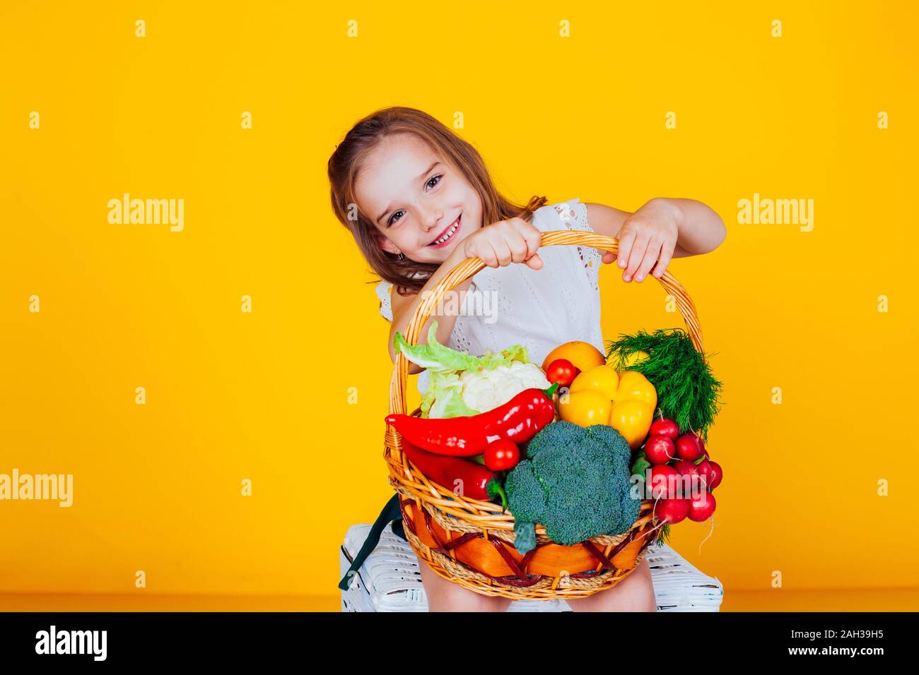 beautiful girl holding a basket of ripe vegetables healthy food Stock ...