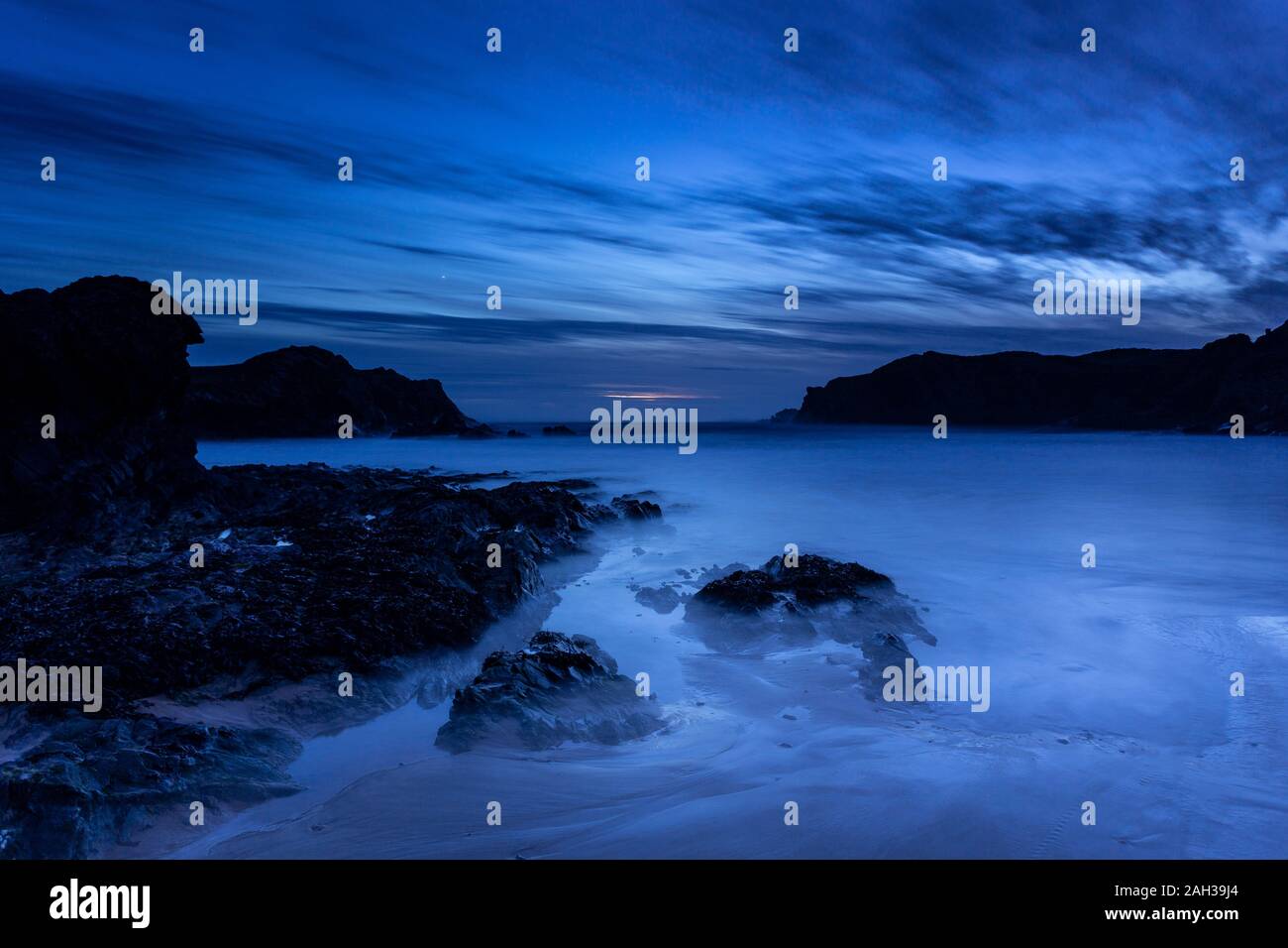 Dusk over the beach at Porth Dafarch on the Anglesey coast, North Wales Stock Photo