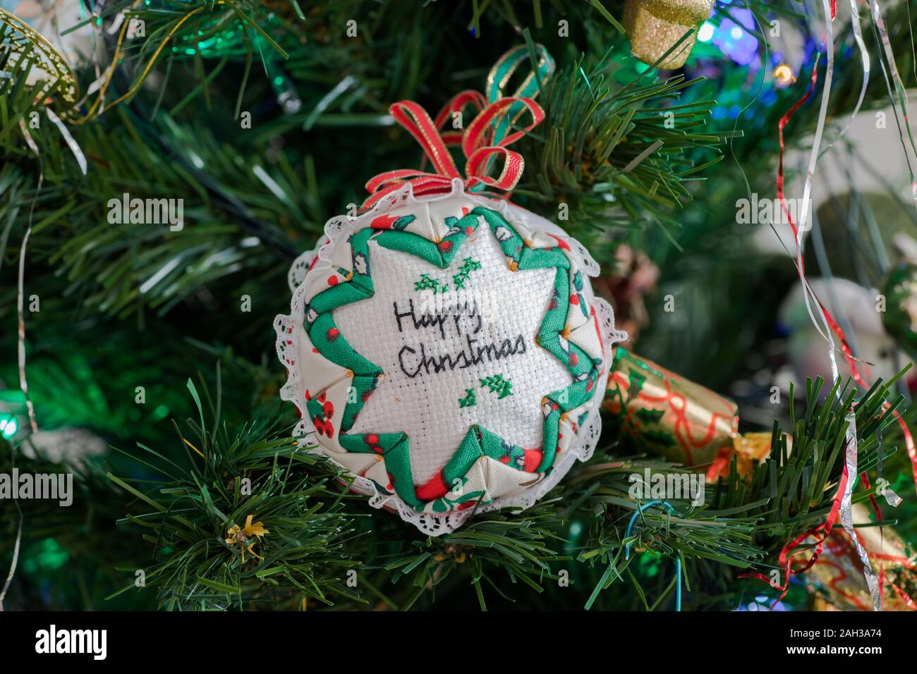Happy Christmas material parcel hanging from Christmas Tree, Taken in
