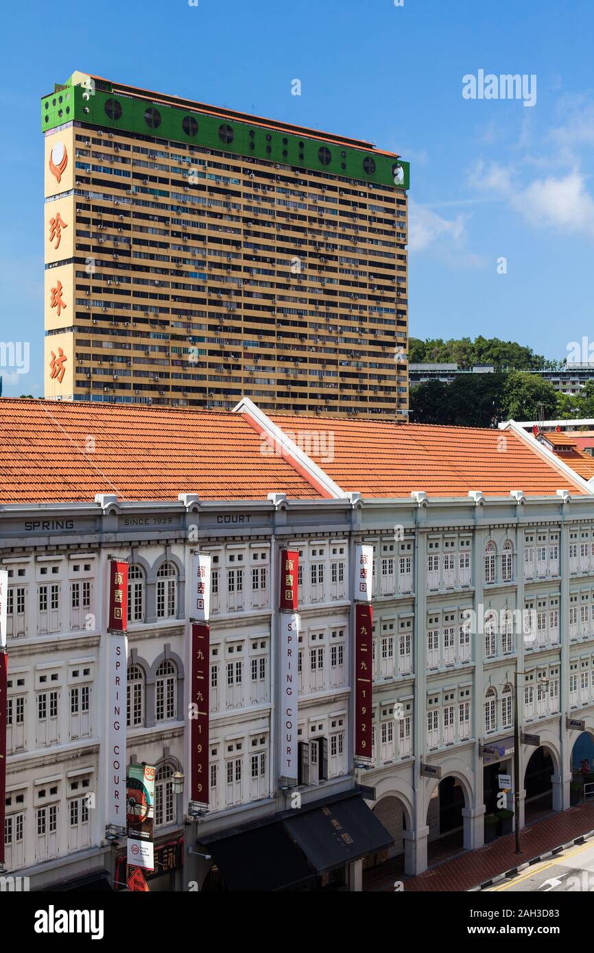 Vertical view architecture of People's Park Complex and white colour multi storey shophouses at Chinatown, Singapore. Stock Photo