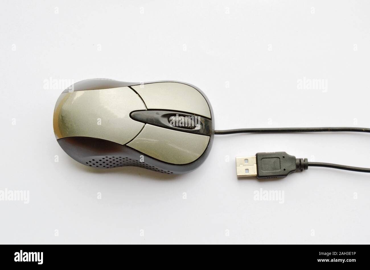 gray computer mouse and cable plug in on white background Stock Photo ...