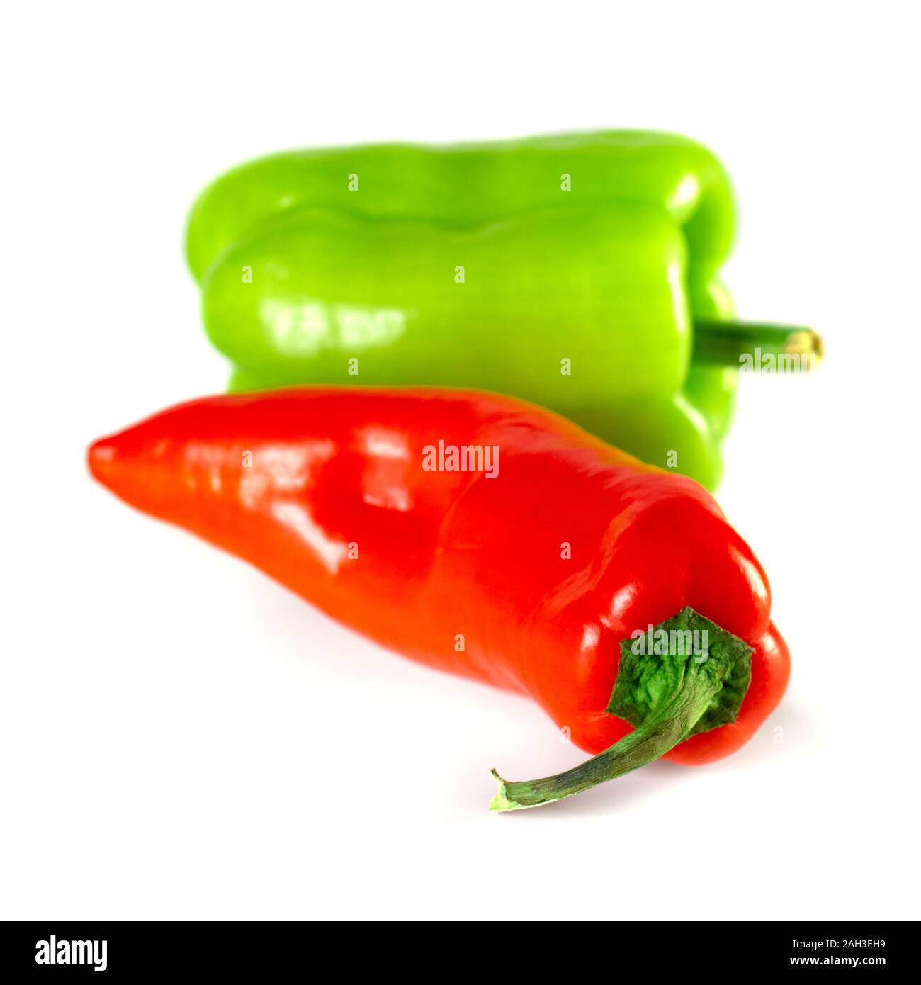 Sweet red and green peppers isolated on white background Stock Photo ...