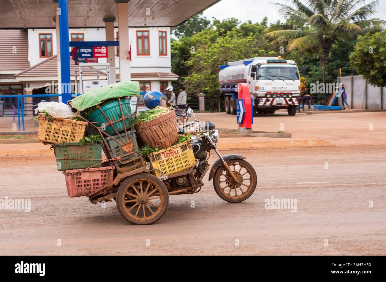 Laongam, Laos overloaded motorcycle Stock Photo