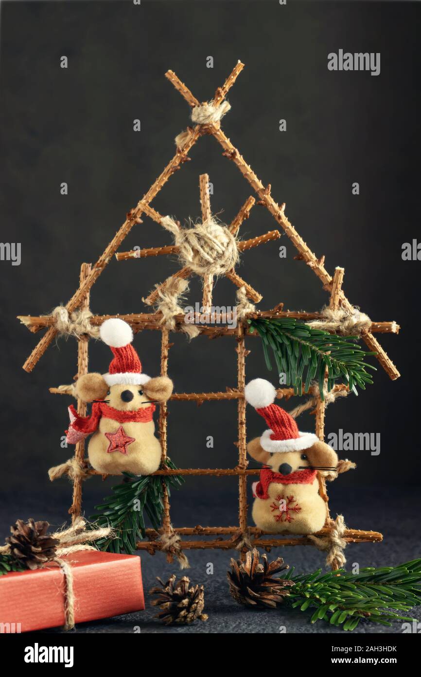 Two Little Toy Christmas Mice Gift And Decorations On A Black