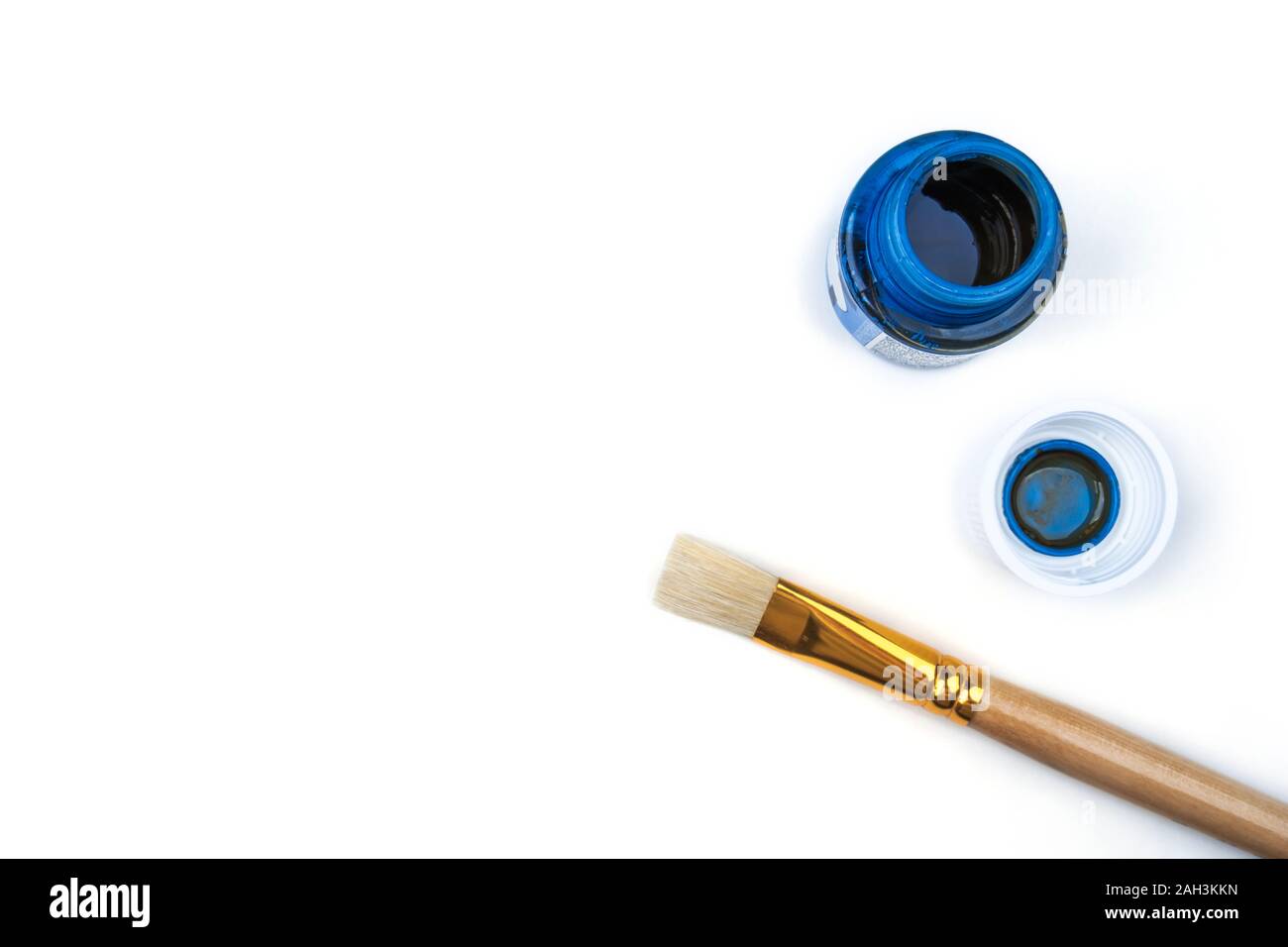 Brush and blue paint on white background Stock Photo - Alamy