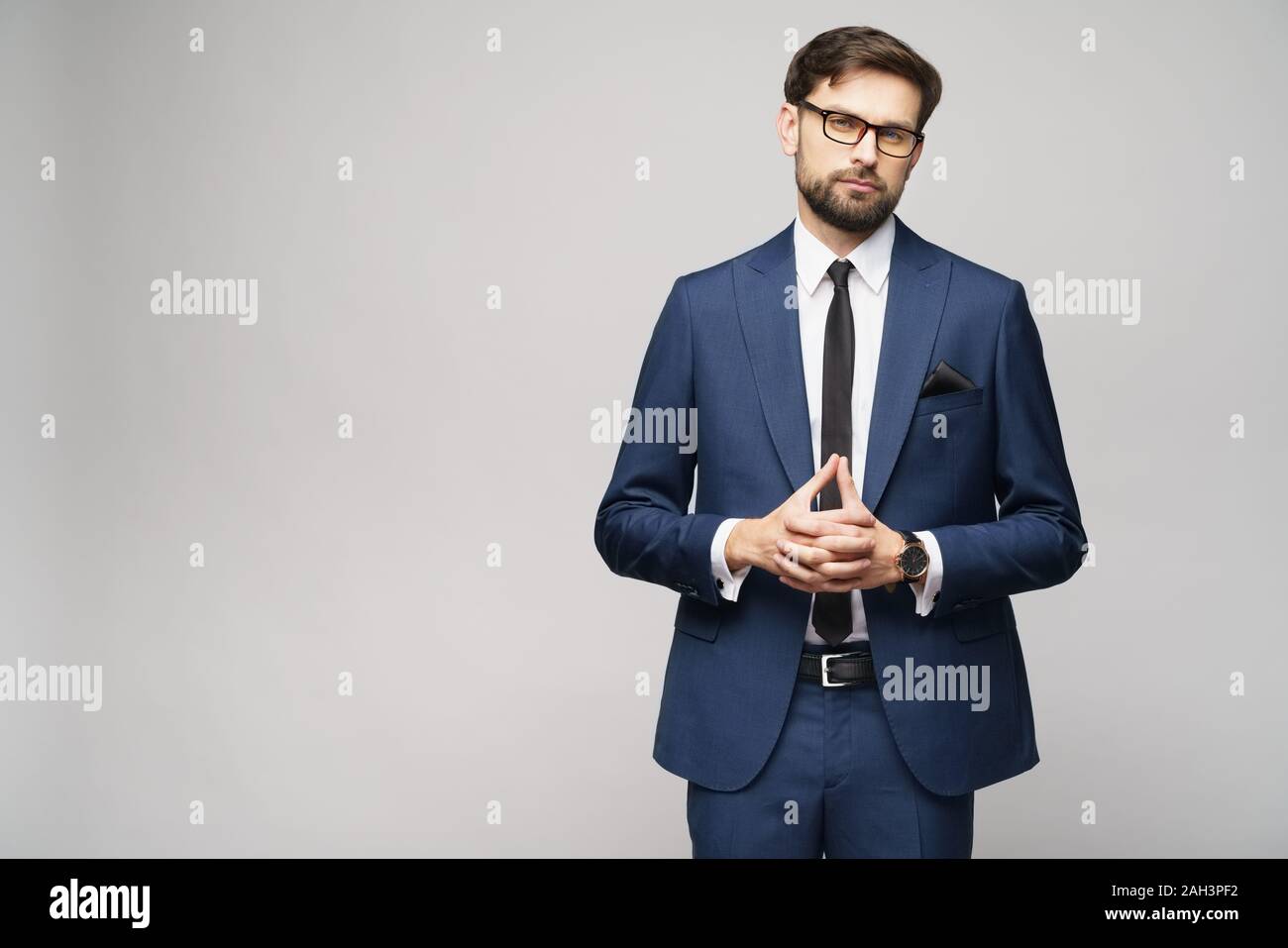 studio photo of young handsome businessman wearing suit Stock Photo - Alamy
