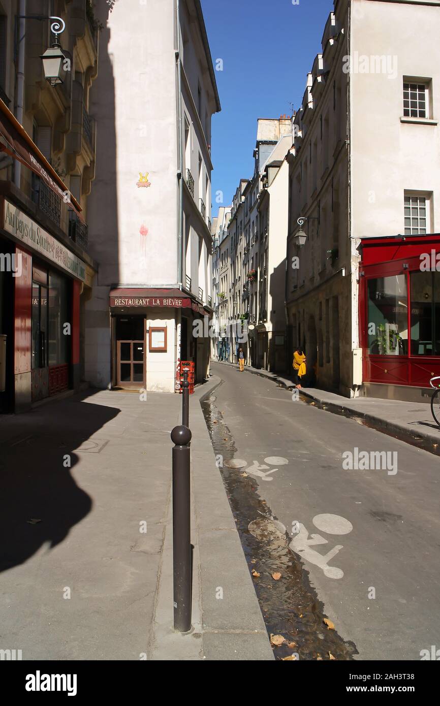 Street scene in the Quartier Latin (5th arr.). This Paris street is at the former location of a river, the Bièvre, which used to flow into the Seine. Stock Photo