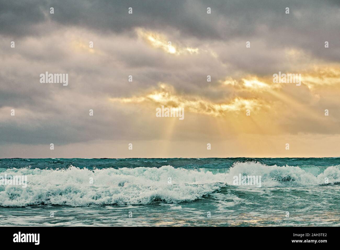 Sunset scenery of the sea along the White Beach of Boracay Island, Philippines. The sea is rougher with Habagat wind blowing during the rainy season. Stock Photo