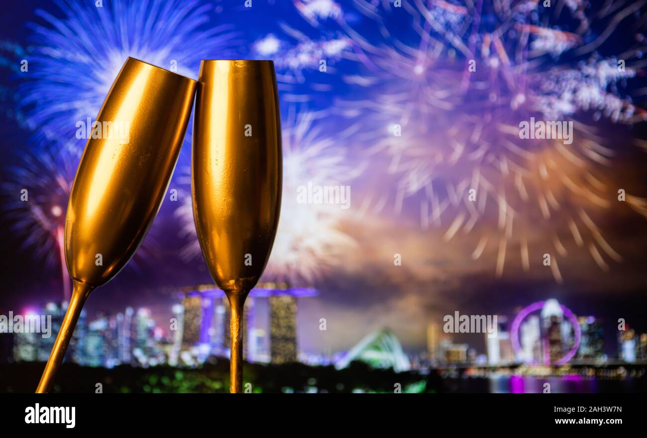 golden champagne glasses and fireworks new year in Singapore Stock ...