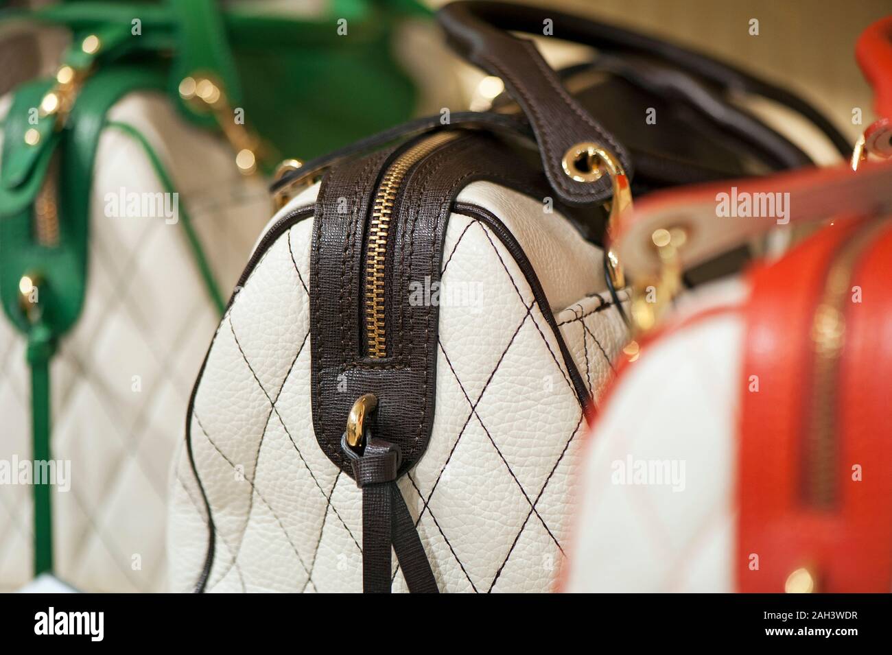 Women's fashion bags on the shelves in the store Stock Photo - Alamy