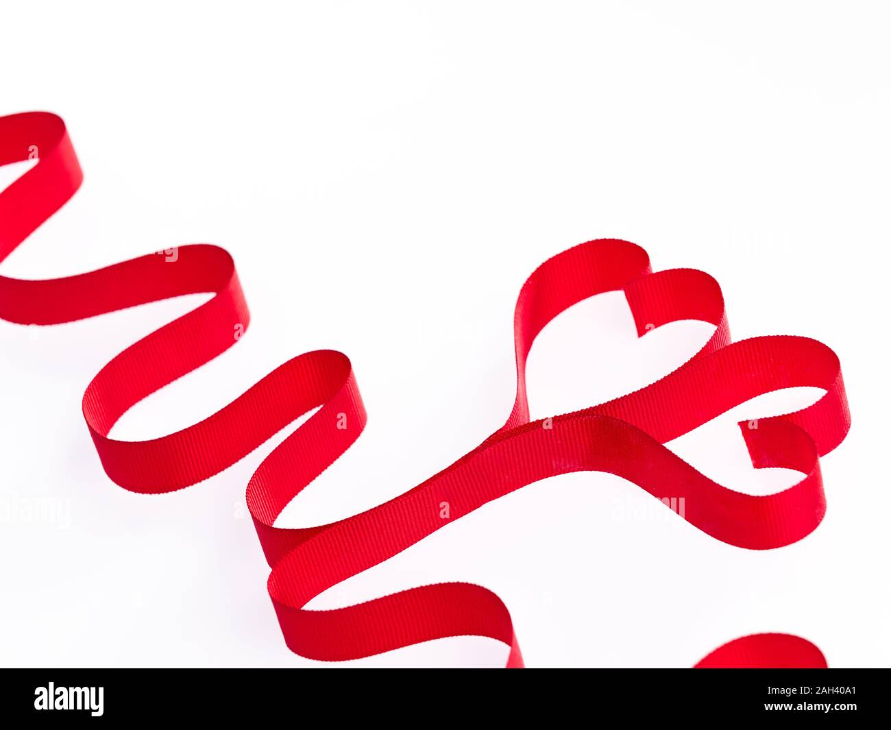 Red heart ribbons on the white background Stock Photo