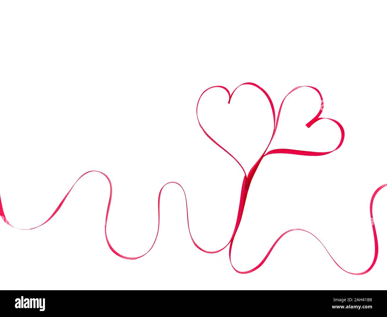Red heart ribbons on the white background Stock Photo