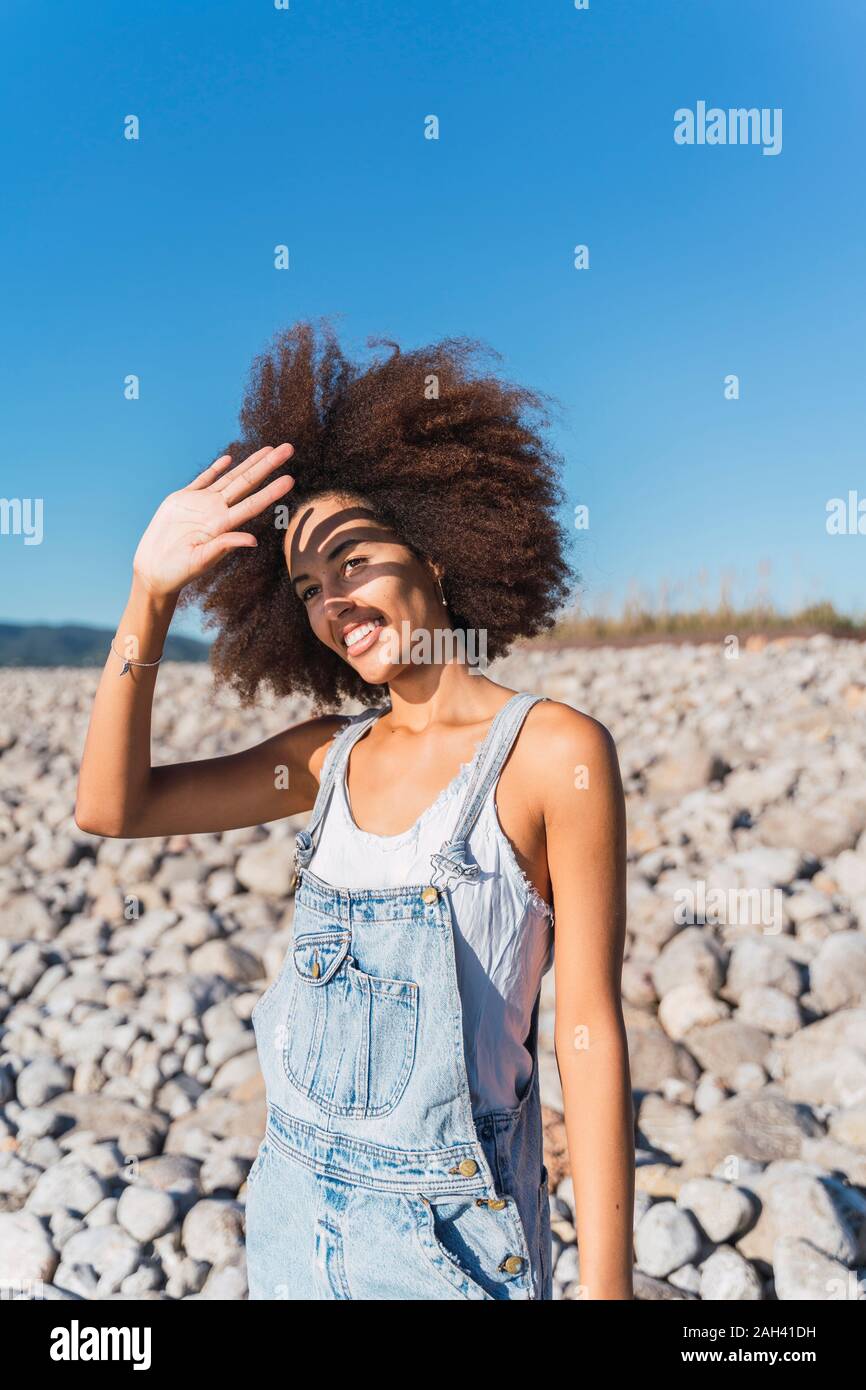 African american woman raising arms hi-res stock photography and images ...
