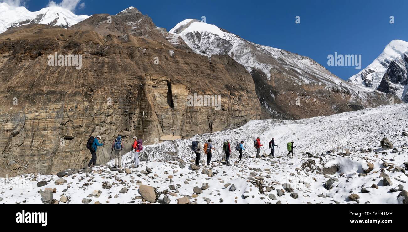 Trekking group at Chonbarden Glacier, Dhaulagiri Circuit Trek, Himalaya, Nepal Stock Photo