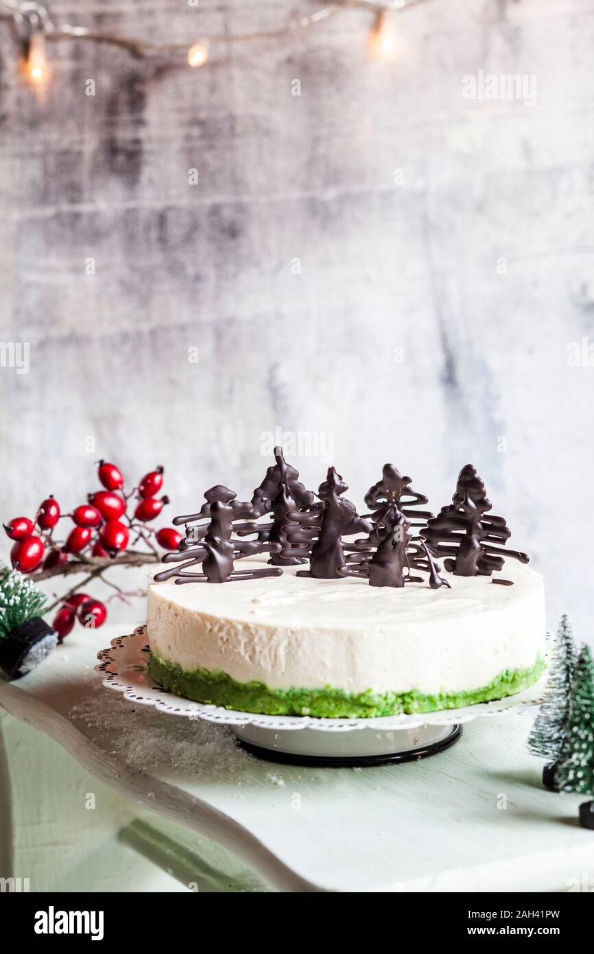 No-bake cheesecake, decorated with chocolate Christmas trees Stock Photo