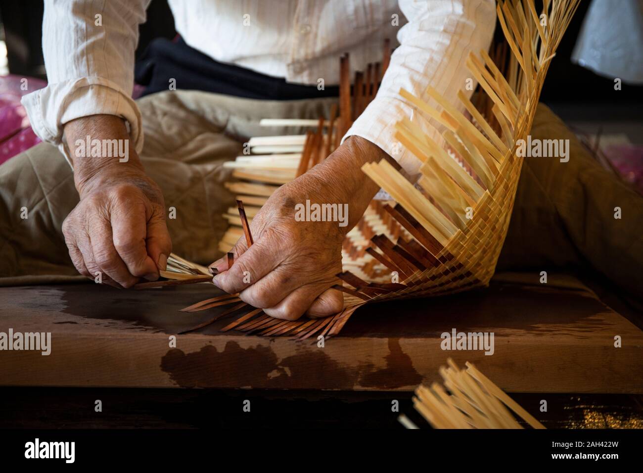 Japan, Takayama, Craftsman making baskets in workshop Stock Photo