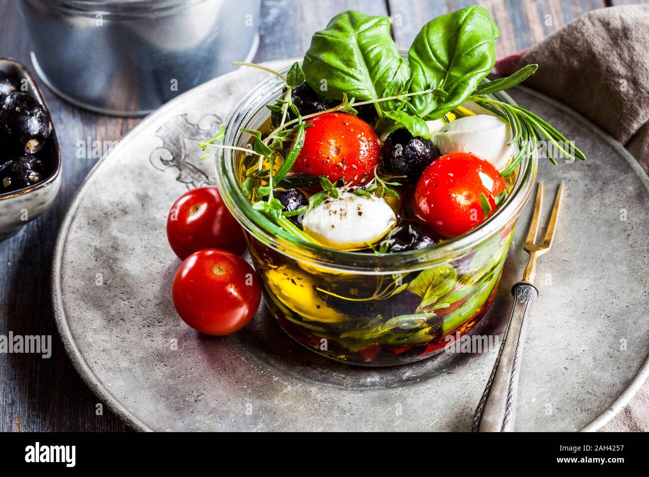 Jar of fresh Caprese salad preserved in olive oil Stock Photo