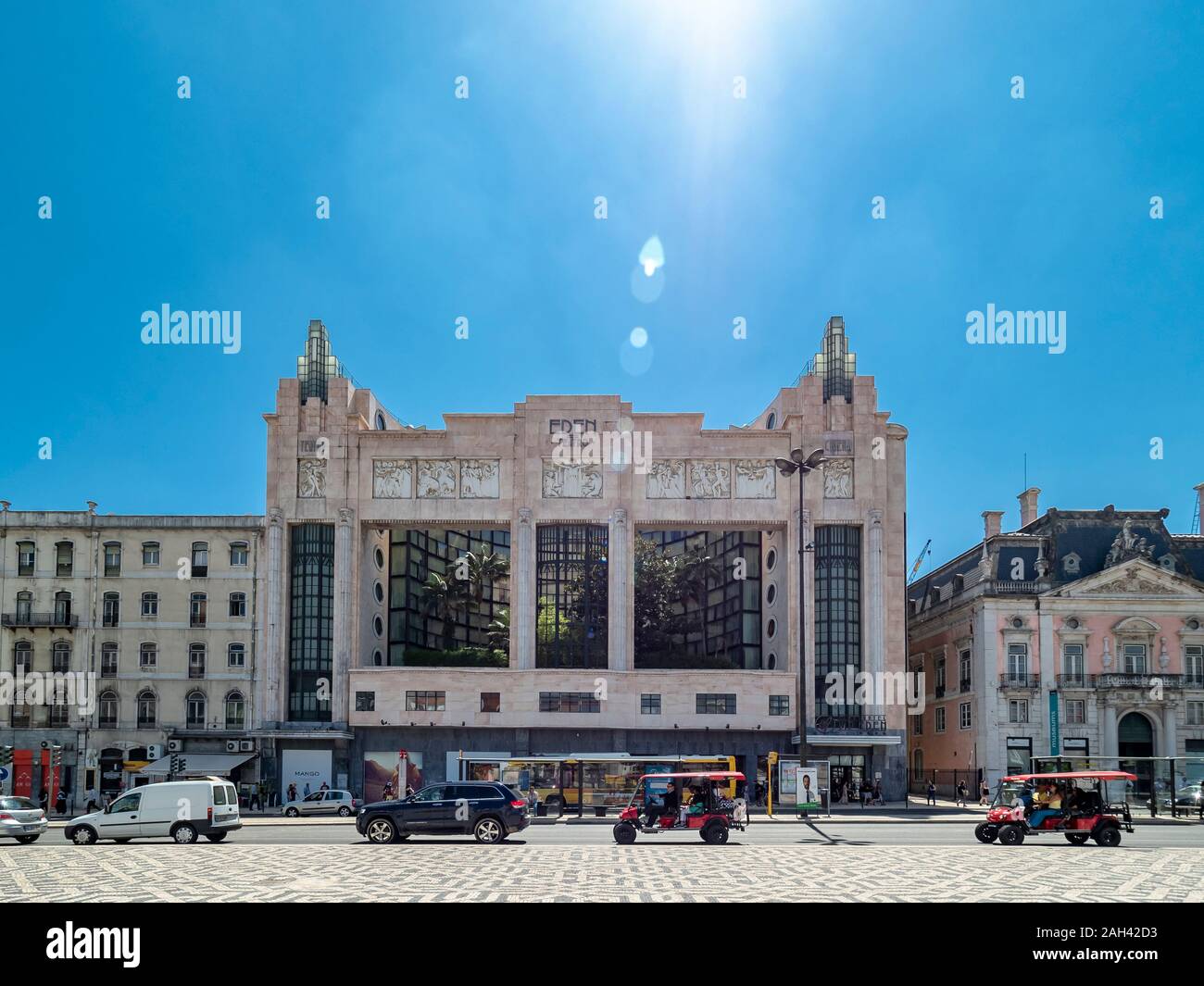 Restauradores Square and the former Teatro Eden against the sun, Lisbon, Portugal Stock Photo