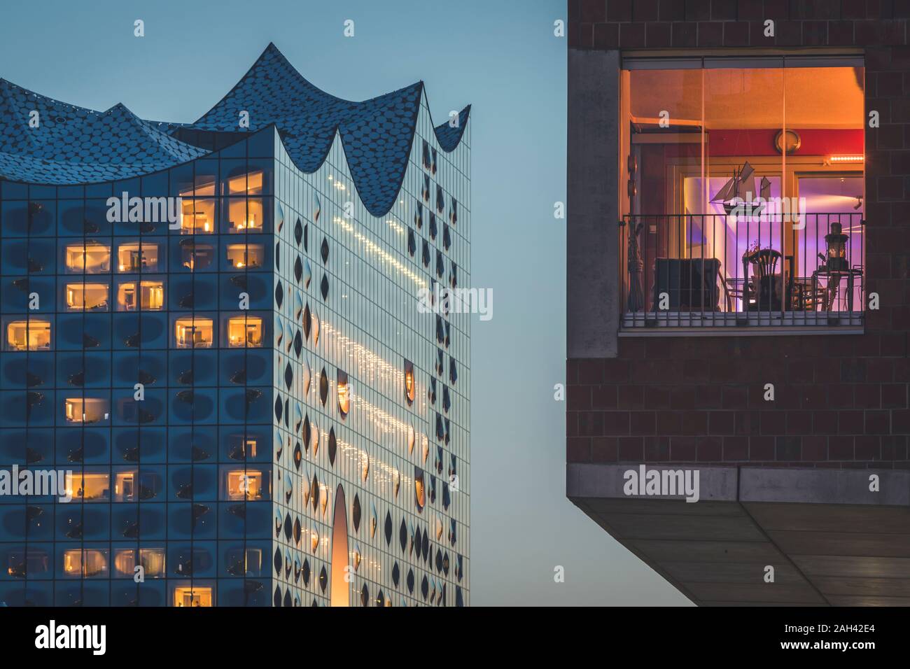 Germany, Hamburg, Hafencity, Sandtorhafen, Elbphilharmonie at dusk Stock Photo