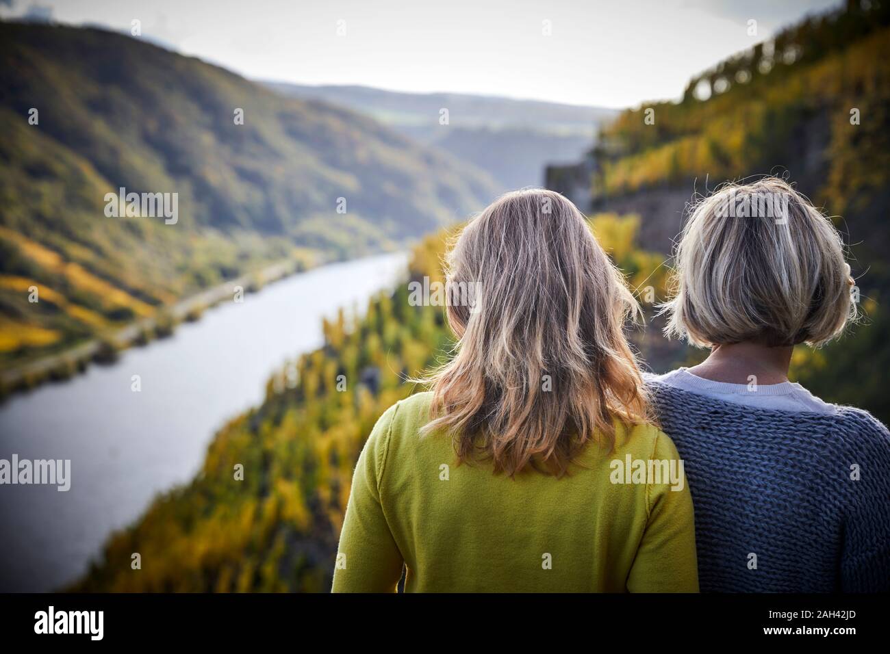 Two mature women enjoying the view from a mountain Stock Photo