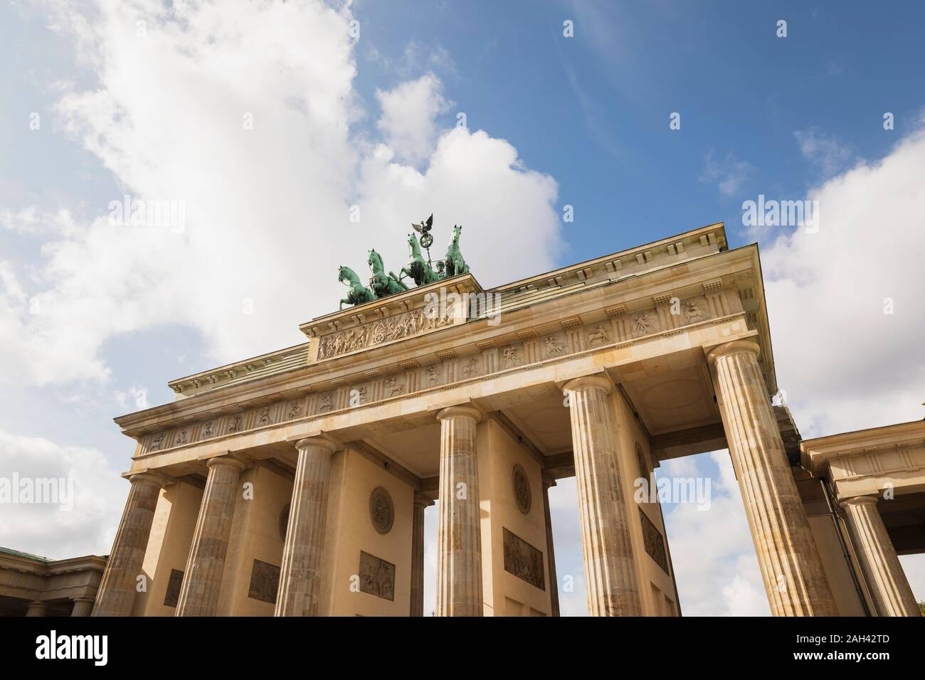 Germany, Berlin, Low angle view of Brandenburg Gate standing against clouds Stock Photo